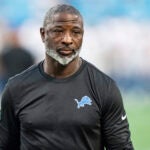 Detroit Lions defensive coordinator Aaron Glenn looks on before a preseason NFL football game against the Carolina Panthers Friday, Aug. 25, 2023, in Charlotte, N.C.