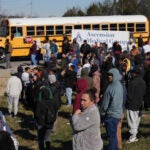 A school bus arrives at unification site following a shooting at the Antioch High School in Nashville, Tenn., Wednesday, Jan. 22, 2025.