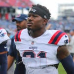 New England Patriots cornerback Jonathan Jones (31) walks the sideline prior to an NFL football game against the Tennessee Titans, Sunday, Nov. 3, 2024, in Nashville, Tenn.