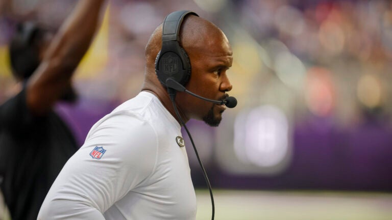 Minnesota Vikings Defensive coordinator Brian Flores walks along the sidelines during the second half of an NFL football game with the Las Vegas Raiders Saturday, Aug. 10, 2024, in Minneapolis.