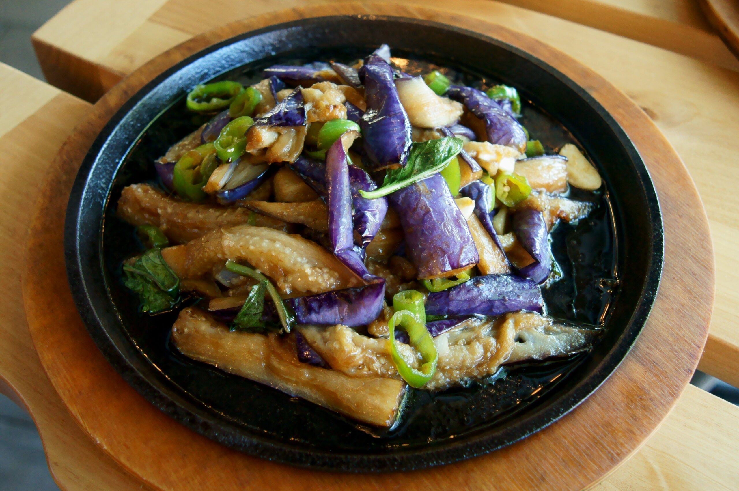 Sizzling Basil Eggplant on a dish at Sumiao Human Cuisine.