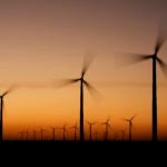 FILE - Wind turbines stretch across the horizon at dusk at the Spearville Wind Farm, Sept. 29, 2024, near Spearville, Kan.