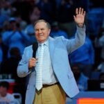 CHAPEL HILL, NORTH CAROLINA - DECEMBER 14: Head coach Bill Belichick of the North Carolina Tar Heels addresses the crowd during halftime in the game against the La Salle Explorers at the Dean E. Smith Center on December 14, 2024 in Greensboro, North Carolina.