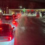 Cars are backed up at the US-Canada border after a shooting involving a U.S. Border Patrol agent in Coventry, VT., Monday, Jan. 20, 2025, in Stanstead, Quebec.