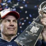 Bill Belichick, head coach of the New England Patriots holds the Vince Lombardi trophy after winning Super Bowl XXXVIII, 01 February 2004 at Reliant Stadium in Houston, Texas. The Patriots beat the Carolina Panthers 32-29 to win the game.