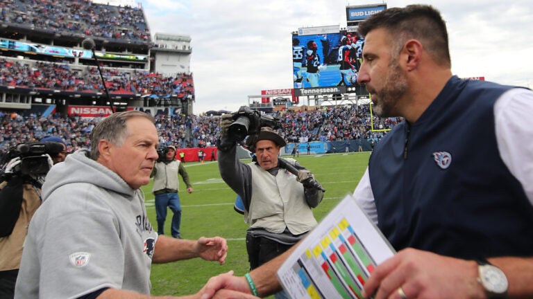 New England Patriots head coach Bill Belichick shaking hands with Tennessee Titans head coach Mike Vrabrel after the Patriots 34-10 loss at Nissan Field.