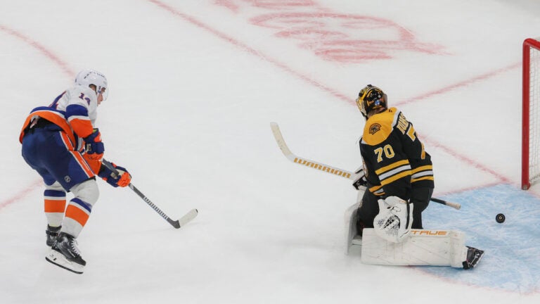 New York Islanders center Bo Horvat scores the game-winning goal, beating Bruins goaltender Joonas Korpisalo during the overtime period.