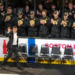 Retired Bruins Patrice Bergeron waves to the fans as he is introduced during a 100 year centennial celebration before the Boston Bruins play the Montreal Canadians during NHL action at TD Garden.