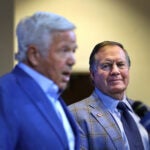 New England Patriots former coach Bill Belichick looks on as owner Robert Kraft addressed the media at Gillette Stadium about Belichick’s departure.