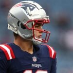 FOXBOROUGH, MASSACHUSETTS - DECEMBER 28: Drake Maye #10 of the New England Patriots looks on before the game against the Los Angeles Chargers at Gillette Stadium on December 28, 2024 in Foxborough, Massachusetts.