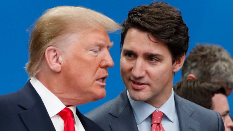 U.S. President Donald Trump and Canadian Prime Minister Justin Trudeau talk.