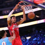 Team Chuck's Victor Wembanyama dunks against Team Shaq's Damian Lillard.