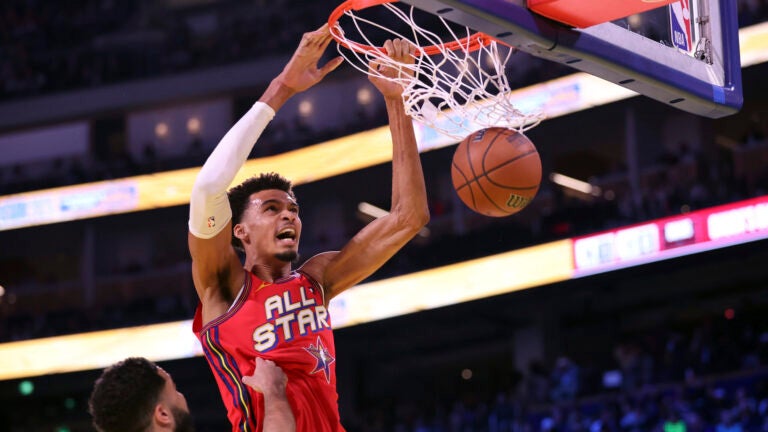 Team Chuck's Victor Wembanyama dunks against Team Shaq's Damian Lillard.
