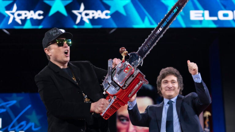 Elon Musk receives a chainsaw from Argentina's President Javier Milei.