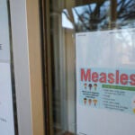 A sign is seen outside a clinic with the South Plains Public Health District.