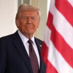 President Donald Trump stands.