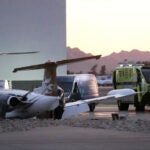 A crashed Learjet sits next to a plane it collided with as a Scottsdale Airport Fire Department vehicle sits nearby at Scottsdale Airport Monday, Feb. 10, 2025, in Scottsdale, Ariz.