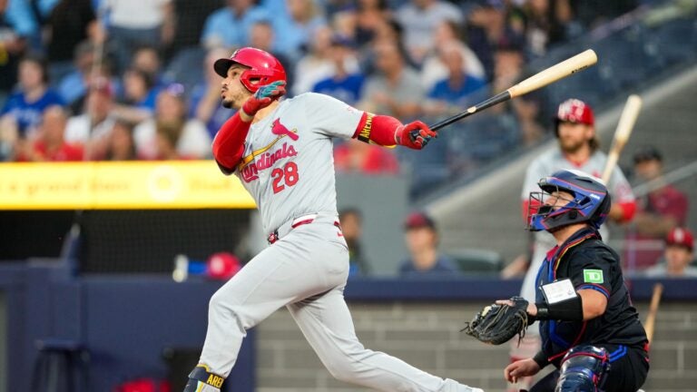 TORONTO, CANADA - September 13: Nolan Arenado #28 of the St. Louis Cardinals hits a single against the Toronto Blue Jays during the first inning at Rogers Centre on September 13, 2024 in Toronto, Canada.