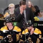 Boston Bruins interim head coach Joe Sacco wipes his forehead during the first period of an NHL hockey game against the Toronto Maple Leafs, Tuesday, Feb. 25, 2025, in Boston.