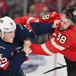 MONTREAL, CANADA - FEBRUARY 15: Matthew Tkachuk #19 of Team USA fights with Brandon Hagel #38 of Team Canada during the first period in the 4 Nations Face-Off game at the Bell Centre on February 15, 2025 in Montreal, Quebec, Canada.