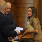 Karen Read looked to her attorneys following a hearing at Norfolk Superior Court.