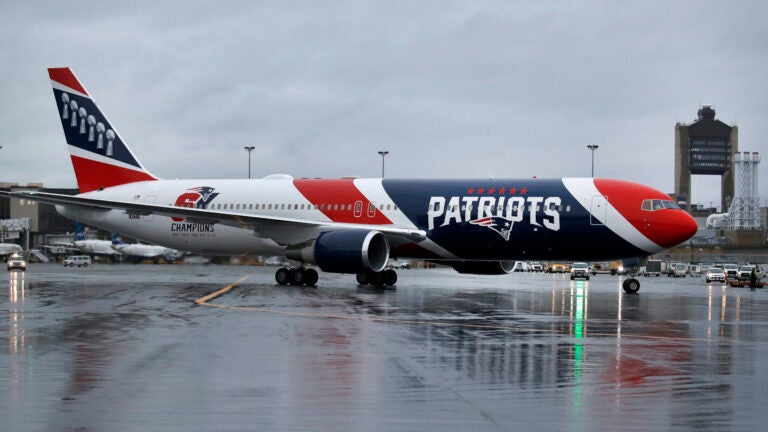 The New England Patriots football team's customized Boeing 767 jet taxis on the tarmac, Thursday, April 2, 2020, at Logan Airport, in Boston, after returning from China with more than one million N95 respirator masks. The Kraft family deployed the Patriots team plane to China to fetch the masks for use by front-line health care workers to prevent the spread of the coronavirus.
