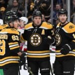BOSTON, MASSACHUSETTS - FEBRUARY 01: Charlie McAvoy #73 of the Boston Bruins reacts after scoring a goal against the New York Rangers during the first period at the TD Garden on February 01, 2025 in Boston, Massachusetts.