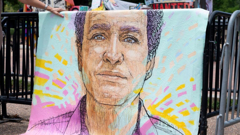 FILE - A drawn portrait of Marc Fogel, who has been detained in Russia since August 2021, hangs on rails outside of the White House during a demonstration organized by his family, July 15, 2023, in Washington.