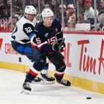 MONTREAL, CANADA - FEBRUARY 13: Patrik Laine #92 of Team Finland checks Charlie McAvoy #25 of Team USA during the first period in the NHL 4 Nations Face-Off at Bell Centre on February 13, 2025 in Montreal, Quebec, Canada.