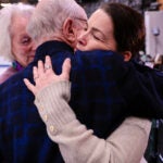 Paul George and Nancy Kerrigan embrace after speaking with the media at The Skating Club of Boston in Norwood, MA January 30, 2025.