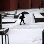 A snow covered walkway at Boston City Hall Plaza.