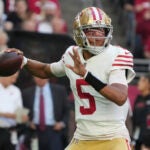 San Francisco 49ers quarterback Joshua Dobbs (5) looks to pass against the Arizona Cardinals during the first half of an NFL football game, Sunday, Jan. 5, 2025, in Glendale, Ariz.