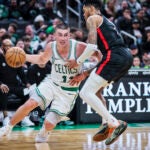 Boston Celtics guard Payton Pritchard (11) drives past Portland Trail Blazers guard Anfernee Simons (1) during the second half of Wednesday’s game at TD Garden.