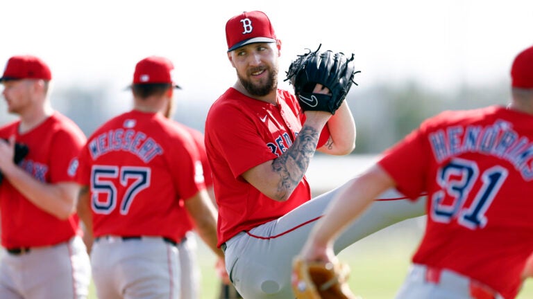 Boston Red Sox pitcher Garrett Crochet (second from right) works out on the first day of spring training at JetBlue Park.