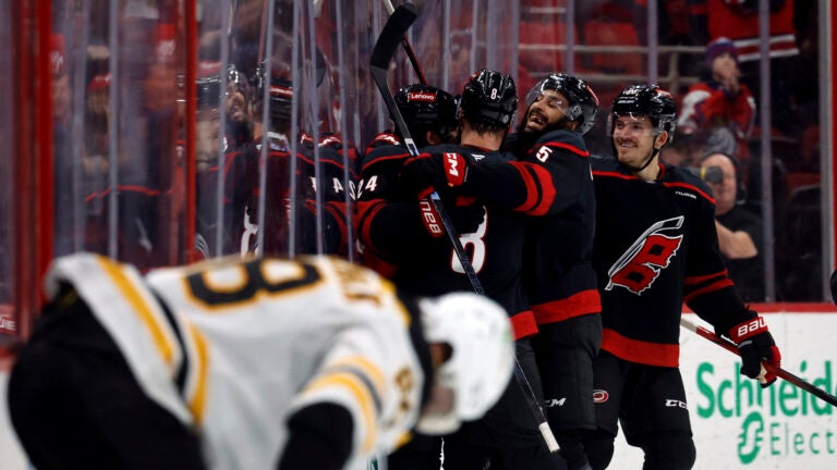 Carolina Hurricanes celebrate after a goal by Seth Jarvis during the third period of an NHL hockey game against the Boston Bruins in Raleigh, N.C., Thursday, March 6, 2025.