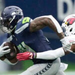 Seattle Seahawks wide receiver DK Metcalf (14) runs after a reception during the first half of an NFL football game against the Arizona Cardinals, Sunday, Nov. 24, 2024, in Seattle.