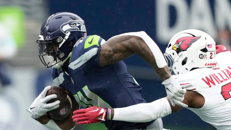 Seattle Seahawks wide receiver DK Metcalf (14) runs after a reception during the first half of an NFL football game against the Arizona Cardinals, Sunday, Nov. 24, 2024, in Seattle.