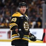 BOSTON, MASSACHUSETTS - DECEMBER 21: Brad Marchand #63 of the Boston Bruins looks on during the first period against the Buffalo Sabres at TD Garden on December 21, 2024 in Boston, Massachusetts.