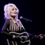 FILE - Dolly Parton performs during an event celebrating the Kansas statewide expansion of Dolly Parton's Imagination Library Monday, Aug. 14, 2023, in Overland Park, Kan.