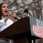 US Representative Alexandria Ocasio Cortez, Democrat of New York, addresses supporters during the "Fighting Oligarchy: Where We Go From Here" rally at Civic Center Park in Denver, Colorado on March 21, 2025.