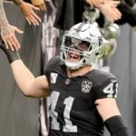 LAS VEGAS, NEVADA - JANUARY 05: Robert Spillane #41 of the Las Vegas Raiders high-fives fans as he takes the field during player introductions before a game against the Los Angeles Chargers at Allegiant Stadium on January 05, 2025 in Las Vegas, Nevada. The Chargers defeated the Raiders 34-20.