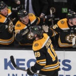 Bruins center Pavel Zacha is congratulated after his goal against the Florida Panthers during the third period.