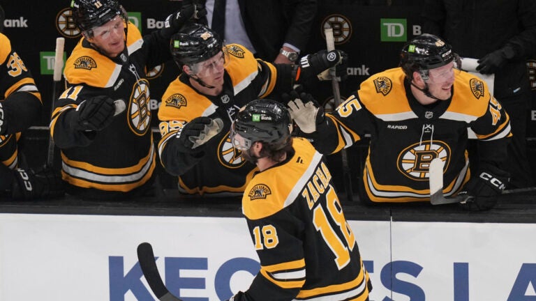 Bruins center Pavel Zacha is congratulated after his goal against the Florida Panthers during the third period.