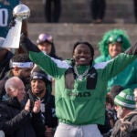 Philadelphia Eagles wide receiver A.J. Brown (11) holds up the Vince Lombardi Trophy during the team's NFL football Super Bowl 59 victory parade and celebration, Friday, Feb. 14, 2025, in Philadelphia..