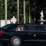 President Donald Trump waves from his limousine as he arrives at his golf club in West Palm Beach, Fla., Saturday, March 8, 2025, in West Palm Beach, Fla.