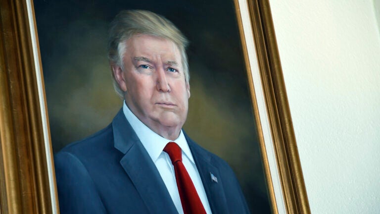 FILE - President Donald Trump's portrait hangs in the Colorado Capitol after an unveiling ceremony, Aug. 1, 2019, in Denver.