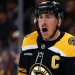 BOSTON, MASSACHUSETTS - DECEMBER 21: Brad Marchand #63 of the Boston Bruins disputes a call during the first period of the game against the Buffalo Sabres at TD Garden on December 21, 2024 in Boston, Massachusetts.