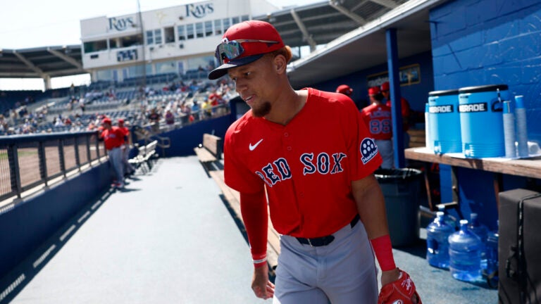 Boston Red Sox infielder Kristian Campbell runs onto the field at Charlotte Sports Park to face the Tampa Bay Rays in an exhibition game during spring training.