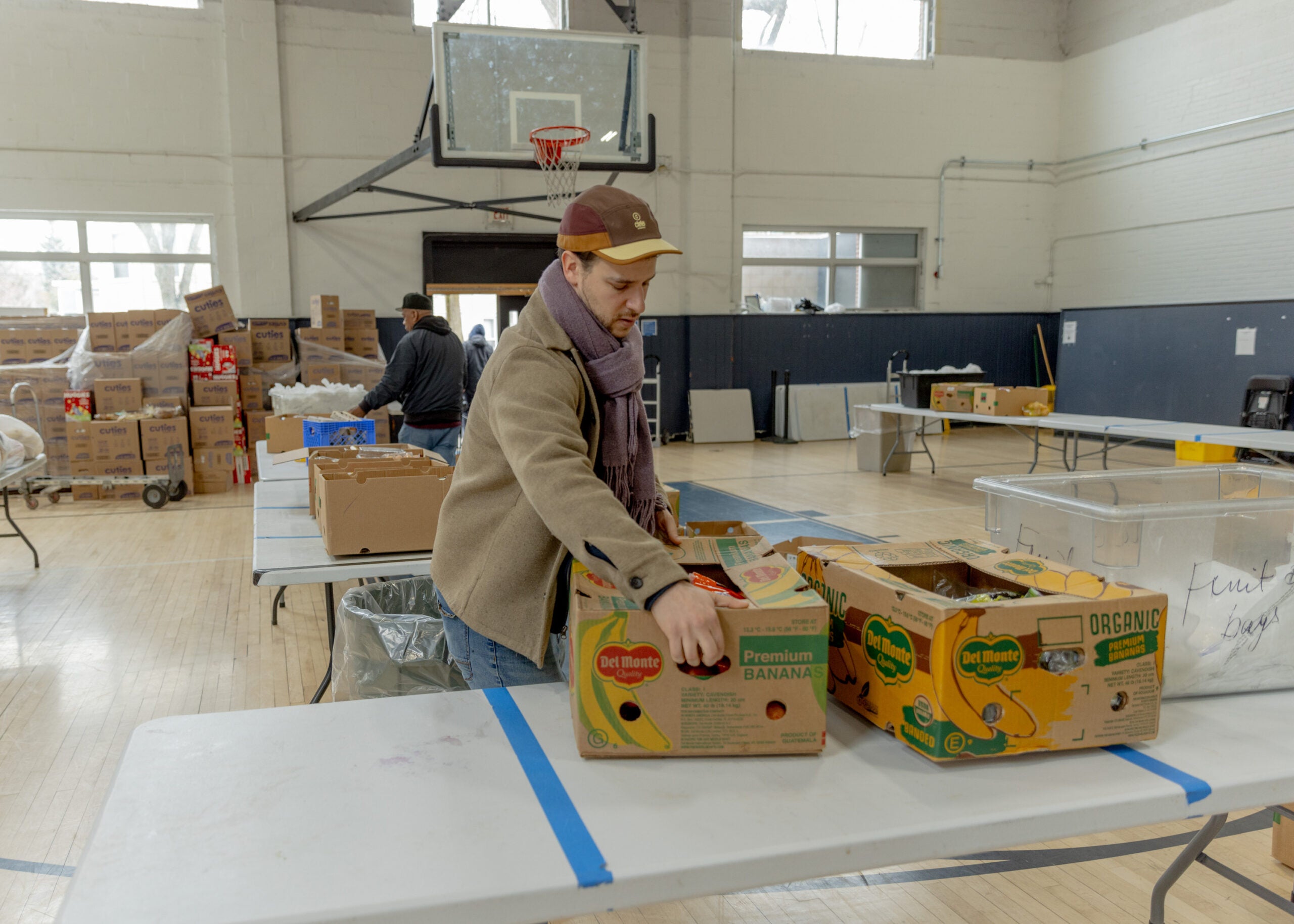 Volunteers work at Cambridge Community Center's food & supply pantry.