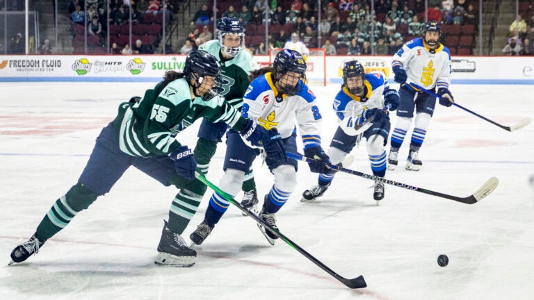 Boston Fleet defense Daniela Pejšová (55) and Toronto Sceptres forward Maggie Connors (22) race towards the puck during the game on Wednesday, March 26, 2025, at Agganis Arena.